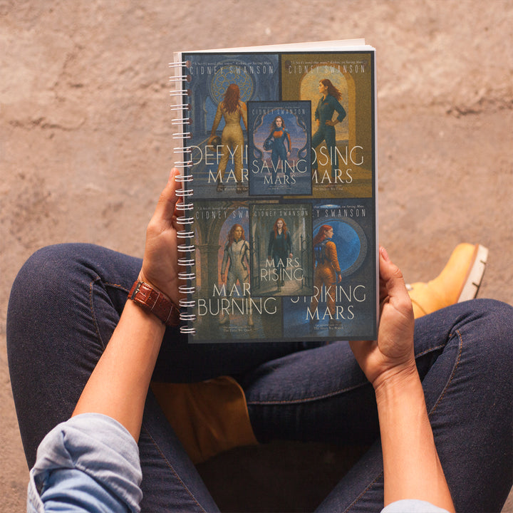teen holding Saving Mars series journal