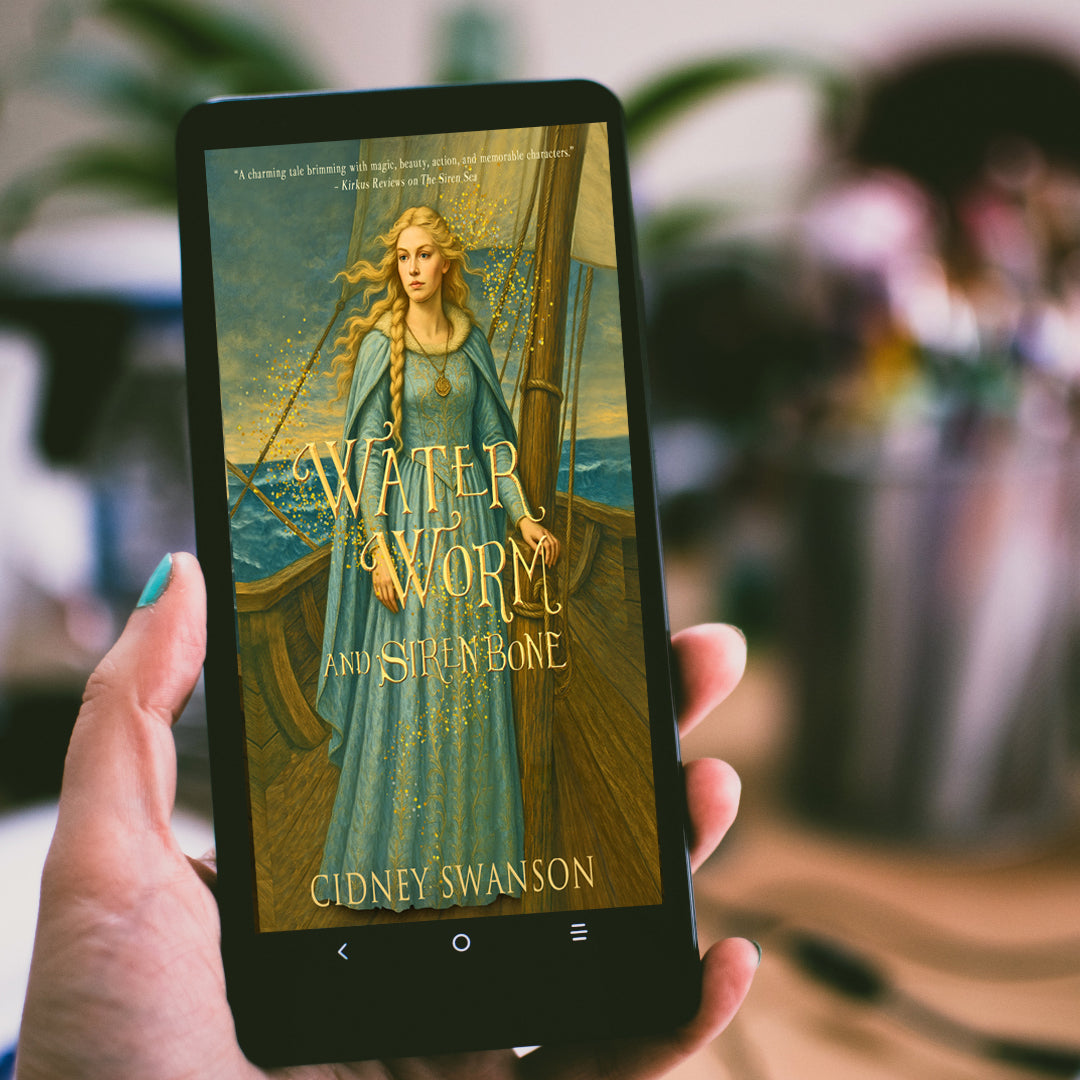 woman holding Water Worm and Siren Bone by Cidney Swanson | lyrical YA fantasy for ages 12–17, part of the Five Kingdoms Chronicles.