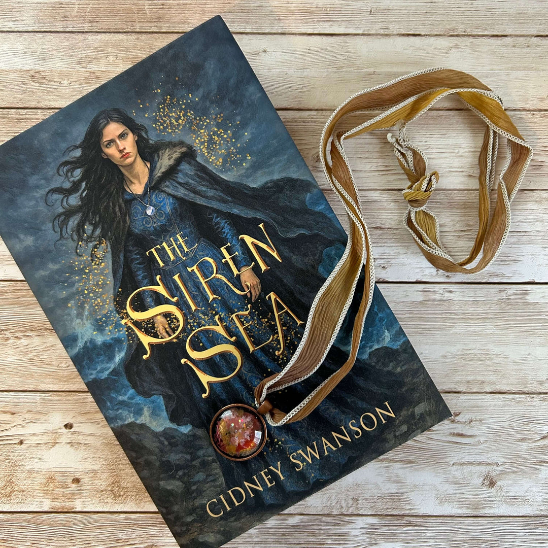 The Siren Sea with pendant draped across the book