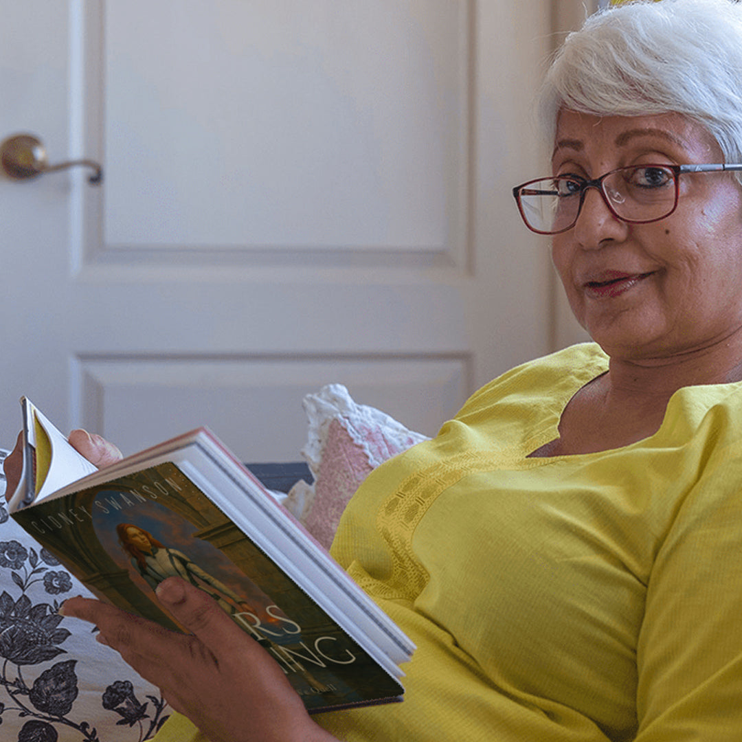 Abuela reading Mars Burning by Cidney Swanson | clean YA sci-fi for ages 10+, part of the Saving Mars series.