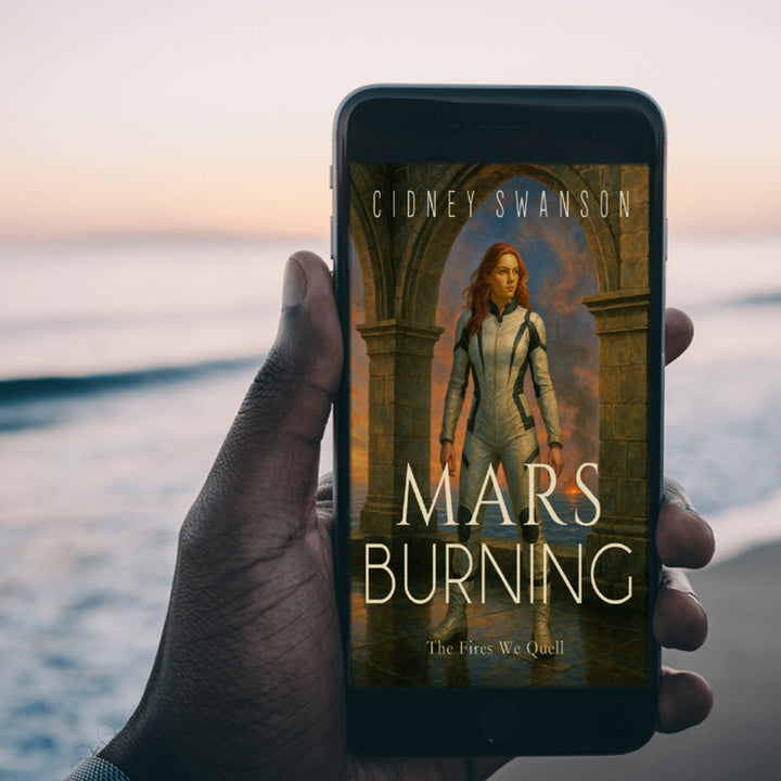 Young man holds Mars Burning by Cidney Swanson | clean YA sci-fi for ages 10+, part of the Saving Mars series.