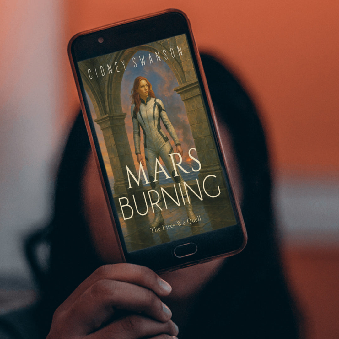 Woman holds phone showing Mars Burning by Cidney Swanson | clean YA sci-fi for ages 10+, part of the Saving Mars series.