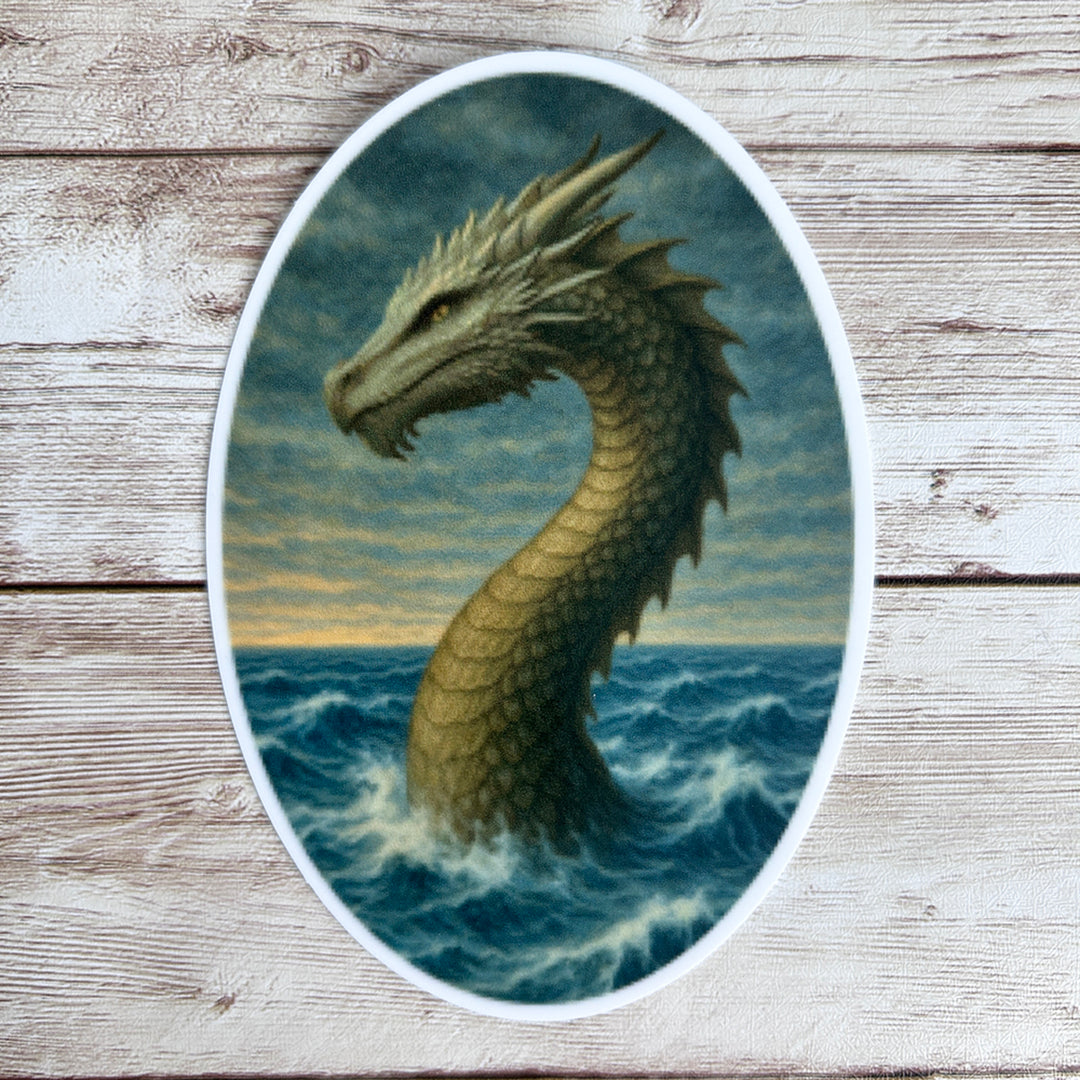 Sticker of the Water Worm Gwenllian shown on a whitened wooden surface