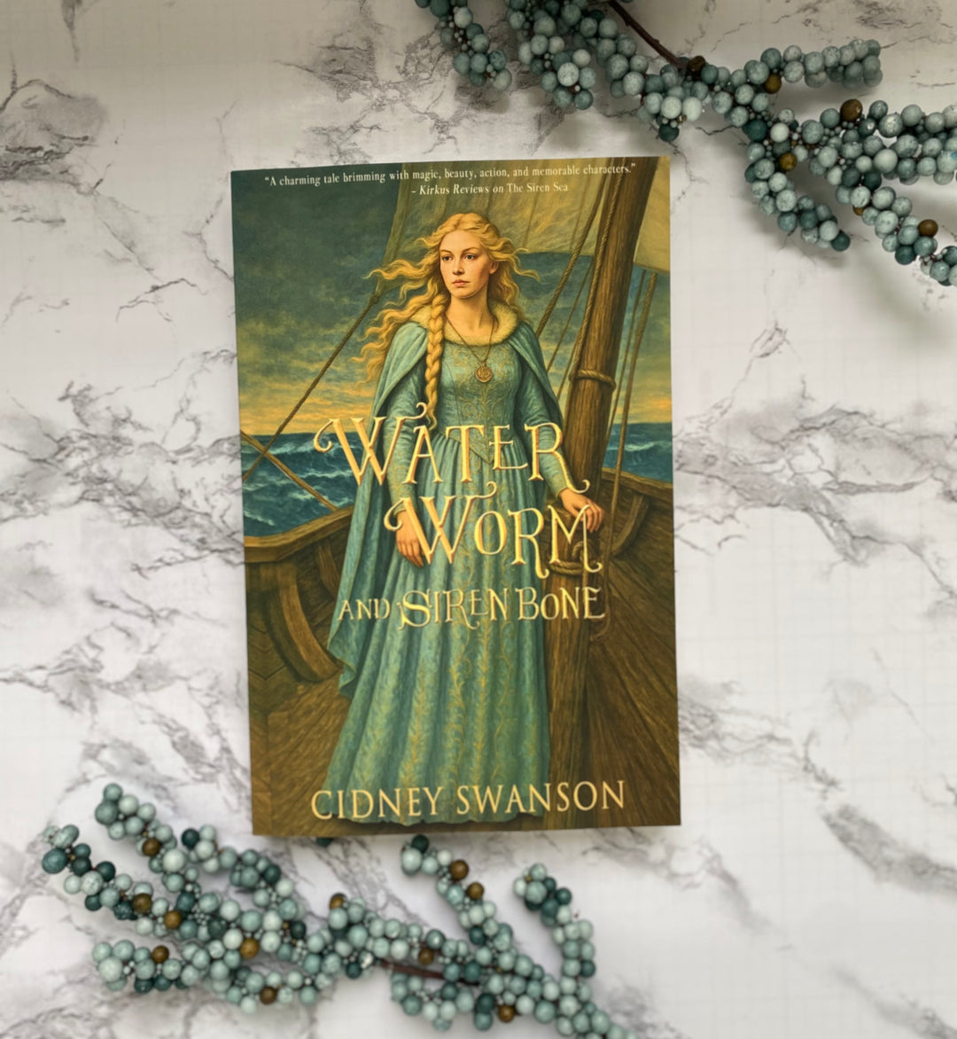A paperback of Water Worm and Siren Bone by Cidney Swanson — clean YA fantasy for ages 12+, second in the Five Kingdoms Chronicles.
