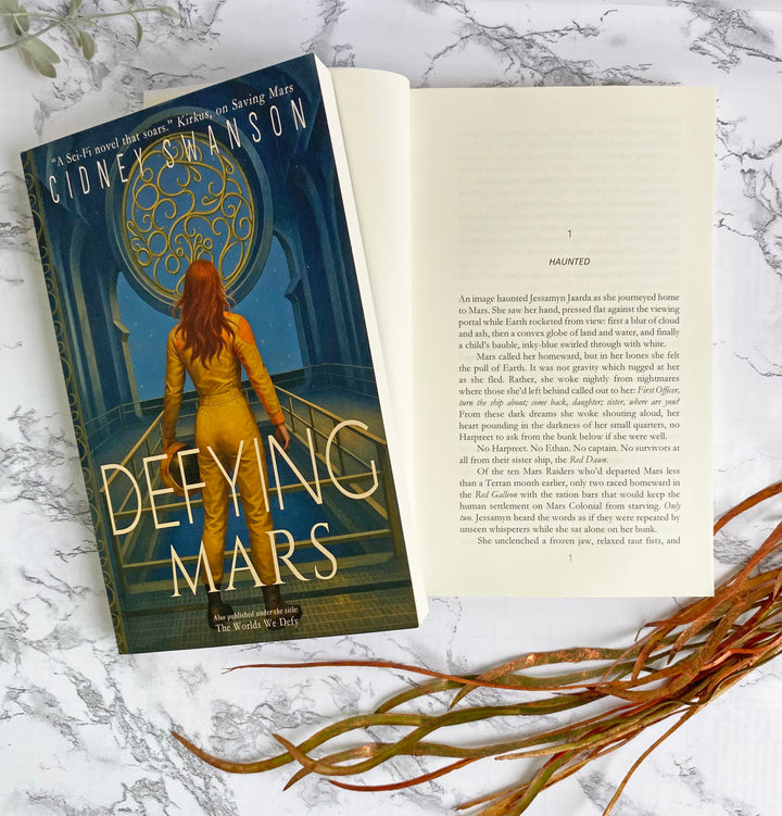 Open page of Defying Mars by Cidney Swanson | clean YA sci-fi for ages 10+, part of the Saving Mars series.