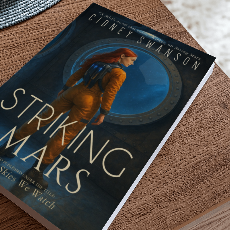 A copy of Striking Mars by Cidney Swanson — clean YA sci-fi for ages 10+, fifth in the Saving Mars series, resting on a table.