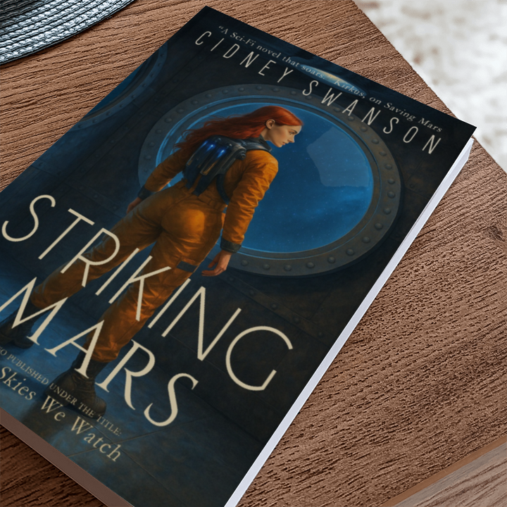 A copy of Striking Mars by Cidney Swanson — clean YA sci-fi for ages 10+, fifth in the Saving Mars series, resting on a table.