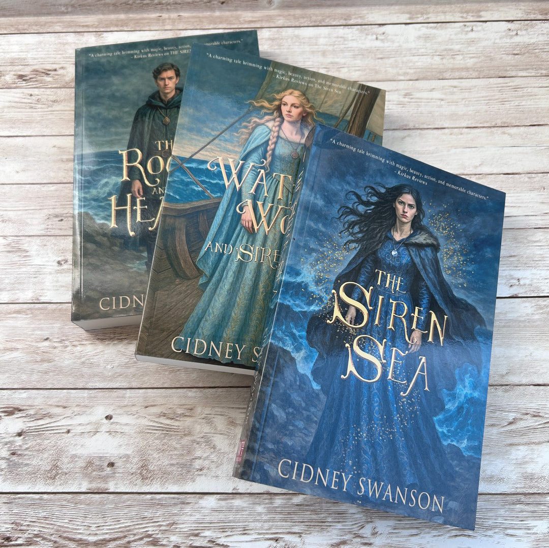 Siren Sea and two other books on whitened wood surface