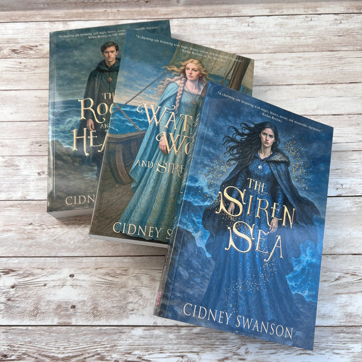 Siren Sea and two other books on whitened wood surface