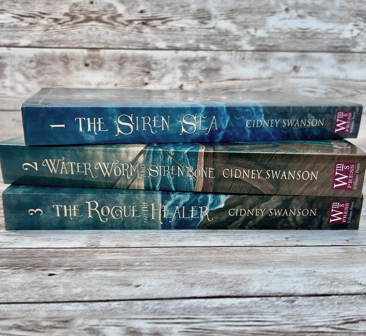 Siren Sea and two other books on marbled surface