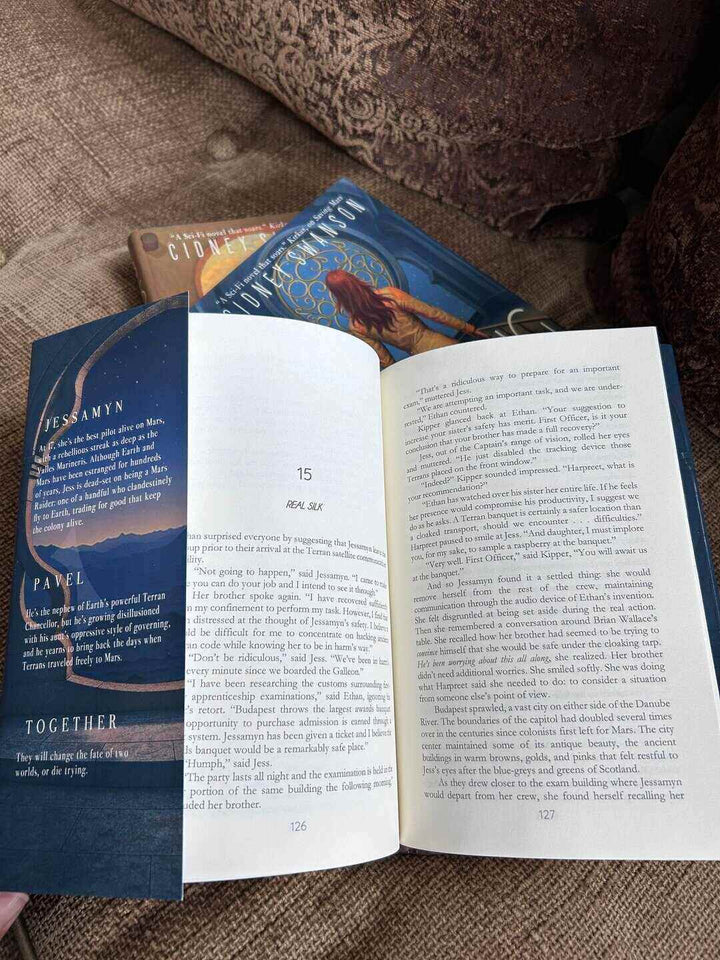 Open book with visible text on a textured surface